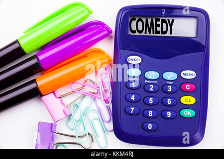 Writing word Comedy text in the office with surroundings such as marker, pen writing on calculator. Business concept for Stand Up Comedy Microphone wh Stock Photo