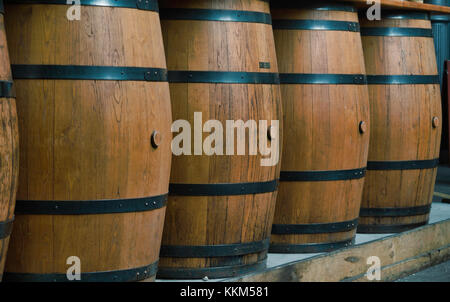 A row of wooden barrels Stock Photo