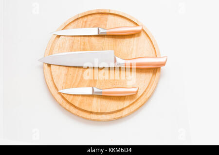 Proffessional chef knifes on the cutting table. Meal preparation. Stock Photo