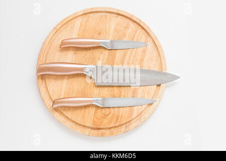 Proffessional chef knifes on the cutting table. Meal preparation. Stock Photo