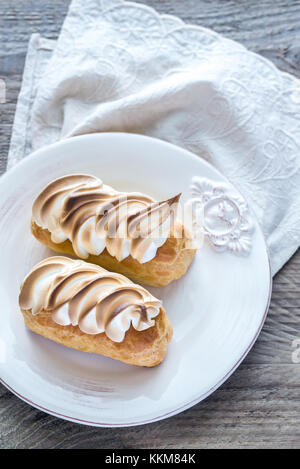 Eclairs with lemon curd and meringue Stock Photo