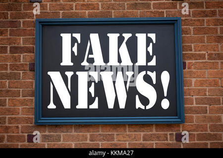 Conceptual hand writing text caption inspiration showing announcement Fake News. Business concept for Propaganda Newspaper Fake News written on frame  Stock Photo