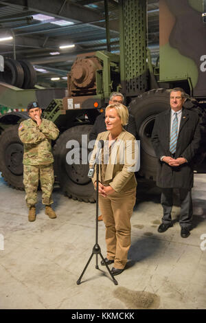 Ann Schrijvers, mayor of Zutendaal, answers the questions of the press after the ribbon cutting ceremony of U.S. Army's pre-positioned stock (APS) 2 site, in Zutendaal, Belgium, Nov. 21, 2017. The APS sites are vital components of total Army readiness as they give combatant commanders the ability to execute operation plans worldwide. (U.S. Army photo by Visual Information Specialist Pierre-Etienne Courtejoie) Stock Photo