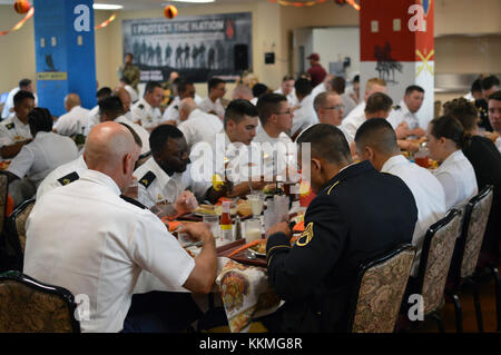 Soldiers assigned to the 3rd Brigade Combat Team, “Broncos,” 25th Infantry Division, enjoy their Thanksgiving meal in the Bronco Dining Facility at Schofield Barracks, Hawaii, on Nov. 22, 2107. (U.S. Army photo by Staff Sgt. Armando R. Limon, 3rd Brigade Combat Team, 25th Infantry Division) Stock Photo