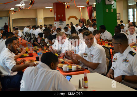 Soldiers assigned to the 3rd Brigade Combat Team, “Broncos,” 25th Infantry Division, enjoy their Thanksgiving meal in the Bronco Dining Facility at Schofield Barracks, Hawaii, on Nov. 22, 2107. (U.S. Army photo by Staff Sgt. Armando R. Limon, 3rd Brigade Combat Team, 25th Infantry Division) Stock Photo