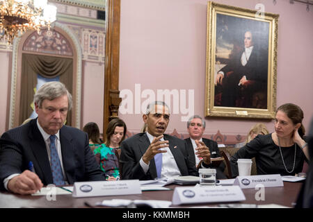 President Barack Obama drops by the Rural Council meeting in the Eisenhower Executive Office Building of the White House, Feb. 3, 2016. (Official White House Photo by Pete Souza)  This official White House photograph is being made available only for publication by news organizations and/or for personal use printing by the subject(s) of the photograph. The photograph may not be manipulated in any way and may not be used in commercial or political materials, advertisements, emails, products, promotions that in any way suggests approval or endorsement of the President, the First Family, or the Wh Stock Photo