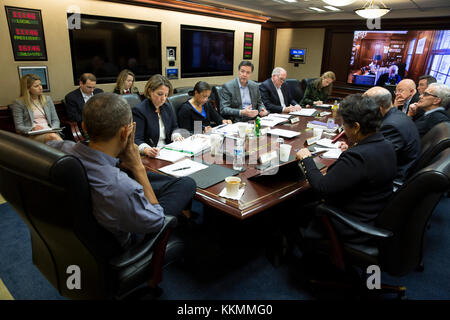 President Barack Obama holds a meeting in the Situation Room to discuss the the San Bernardino, Calif., shootings, Saturday, Dec. 5, 2015. Here, the Presidents receives an update on the investigation from FBI Director James Comey. (Official White House Photo by Pete Souza) Stock Photo