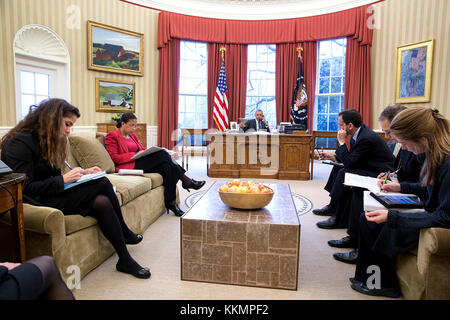 President Barack Obama talks on the phone with Chancellor Angela Merkel of Germany in the Oval Office, March 27, 2015. Attendees from left are Sahar Nowrouzzadeh, Director for Iran; National Security Advisor Susan E. Rice; Phil Gordon, White House Coordinator for the Middle East, North Africa, and the Gulf Region; Charles Kupchan, Senior Director for European Affairs and Avril Haines, Deputy National Security Advisor. (Official White House Photo by Pete Souza)  This official White House photograph is being made available only for publication by news organizations and/or for personal use printi Stock Photo