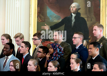 A portrait of George Washington is the backdrop for Senate Youth Program participants as they listen to President Barack Obama in the East Room of the White House, March 12, 2015. (Official White House Photo by Pete Souza)  This official White House photograph is being made available only for publication by news organizations and/or for personal use printing by the subject(s) of the photograph. The photograph may not be manipulated in any way and may not be used in commercial or political materials, advertisements, emails, products, promotions that in any way suggests approval or endorsement o Stock Photo