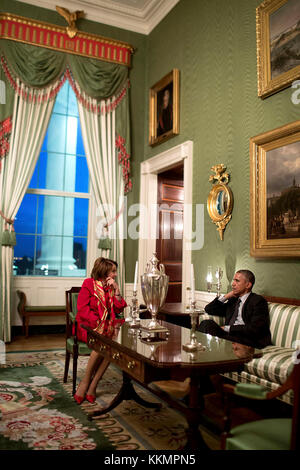 President Barack Obama talks with House Democratic Leader Nancy Pelosi, D-Calif., in the Green Room of the White House, Feb. 4, 2015. (Official White House Photo by Pete Souza)  This official White House photograph is being made available only for publication by news organizations and/or for personal use printing by the subject(s) of the photograph. The photograph may not be manipulated in any way and may not be used in commercial or political materials, advertisements, emails, products, promotions that in any way suggests approval or endorsement of the President, the First Family, or the Whit Stock Photo