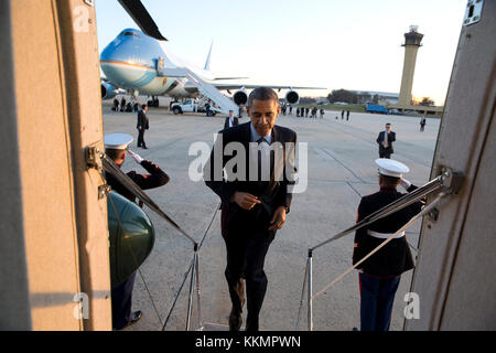 President Barack Obama boards Marine One at Joint Base Andrews, Md., en route to the White House following a trip to New Jersey, Dec. 15, 2014. (Official White House Photo by Pete Souza)  This official White House photograph is being made available only for publication by news organizations and/or for personal use printing by the subject(s) of the photograph. The photograph may not be manipulated in any way and may not be used in commercial or political materials, advertisements, emails, products, promotions that in any way suggests approval or endorsement of the President, the First Family, o Stock Photo