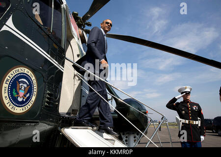 President Barack Obama disembarks Marine One at the Brackett Field landing zone in San Dimas, Calif., Oct. 10, 2014. (Official White House Photo by Pete Souza)  This official White House photograph is being made available only for publication by news organizations and/or for personal use printing by the subject(s) of the photograph. The photograph may not be manipulated in any way and may not be used in commercial or political materials, advertisements, emails, products, promotions that in any way suggests approval or endorsement of the President, the First Family, or the White House. Stock Photo