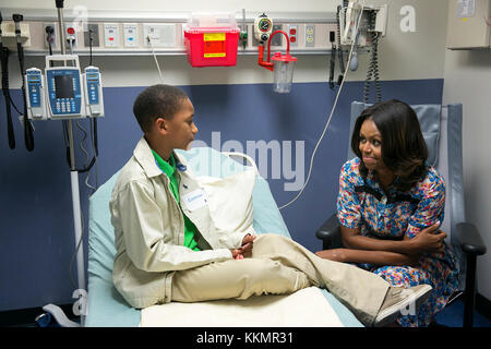 First Lady Michelle Obama visits with Camron Stevens in his room at St. Jude Children's Research Hospital in Memphis, Tenn., Sept. 17, 2014. Stock Photo
