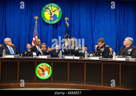 President Barack Obama participates in a briefing on the campaign against the terrorist group ISIL in Iraq and Syria, held at U.S. Central Command at MacDill Air Force Base in Tampa, Fla., Sept. 17, 2014. The President is seated between Defense Secretary Chuck Hagel and Gen. Lloyd J. Austin III, Commander, U.S. Central Command, right. Stock Photo