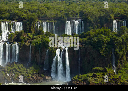 Tourists on walkway above Iguazu Falls, Argentina, seen from Brazil side, South America