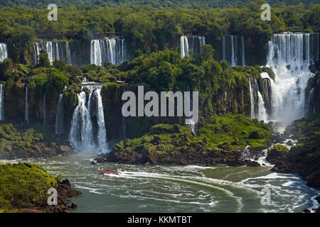 Tourists on walkway above Iguazu Falls, Argentina, seen from Brazil side, South America