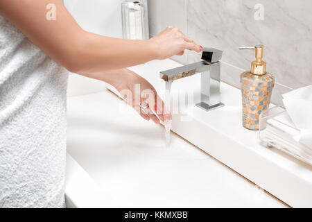woman is washed clean water in the bathroom