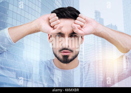 Enigmatical male person looking sideways Stock Photo