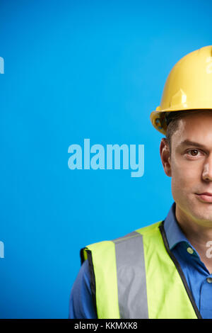 Young white construction worker in hard hat, vertical, crop Stock Photo