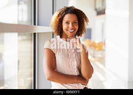 Portrait of smiling young woman looking to camera, close up Stock Photo