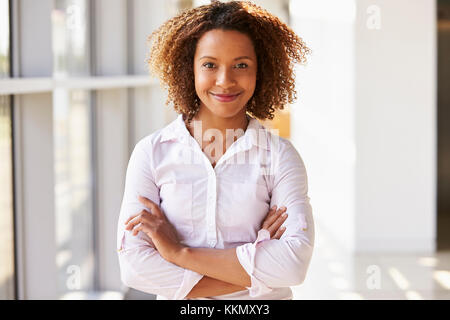 Portrait of smiling young woman looking to camera Stock Photo