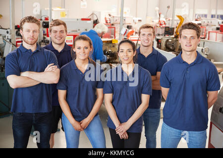 Apprentice engineers in their workplace, group portrait Stock Photo