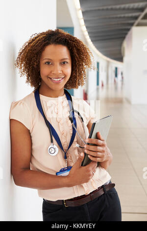 Portrait of young doctor with stethoscope, looking at camera Stock Photo