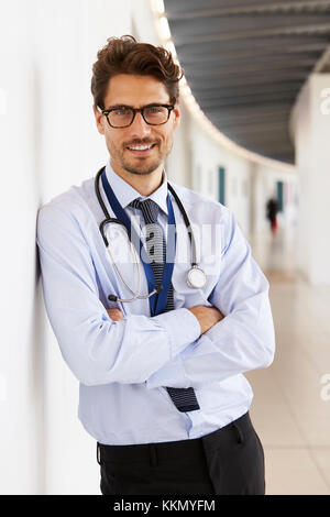 Portrait of young male doctor with stethoscope, smiling Stock Photo