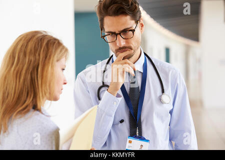 Young male and female doctors talking, close up Stock Photo