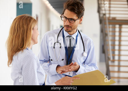 Young male and female doctors consulting each other Stock Photo