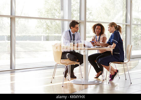 Three senior healthcare workers in a meeting Stock Photo