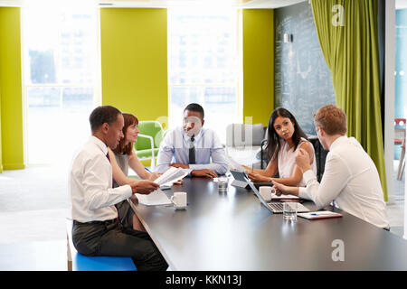Business colleagues having an informal meeting at work Stock Photo