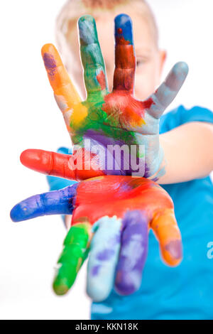 portrait of caucasian child with painted hands isolated on white background