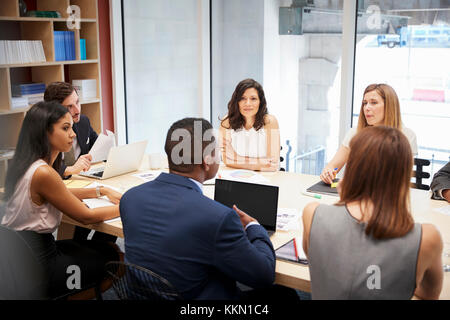 Medium group of people at a boardroom meeting Stock Photo