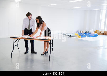 Businesswomen discussing plans for office interior design Stock Photo
