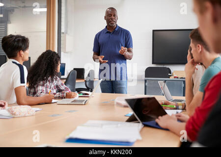 Teacher In Lesson For College Students Studying CAD/3D Design Stock Photo