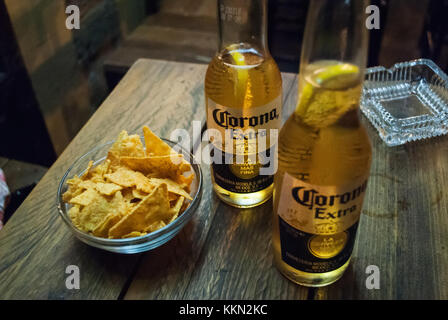 Rhodes, Greece - August 26, 2017: Corona beer with chips on the table Stock Photo