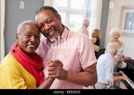 Portrait Of Senior Couple Enjoying Dancing Club Together Stock Photo