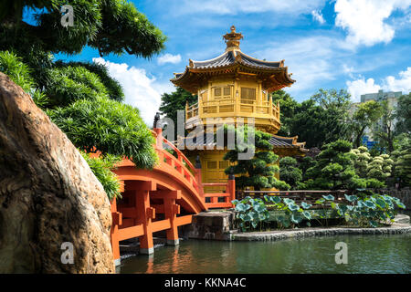 Front view the Golden pavilion temple with red bridge in Nan Lian garden, Hong Kong. Asia. Stock Photo