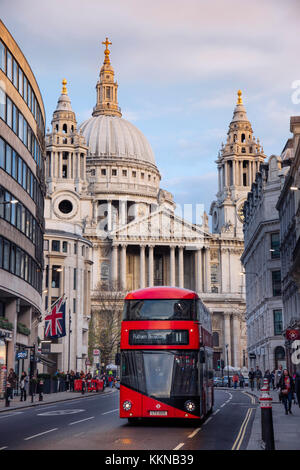 Red London double-decker bus in front of St Paul's Cathedral in the City of London financial district Stock Photo