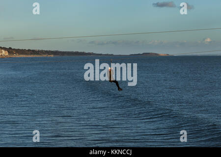 Person on a zip wire (Bournemouth Pier) Stock Photo