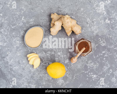 Top view of ginger slice, ginger root, ginder powder, lemon and honey Stock Photo