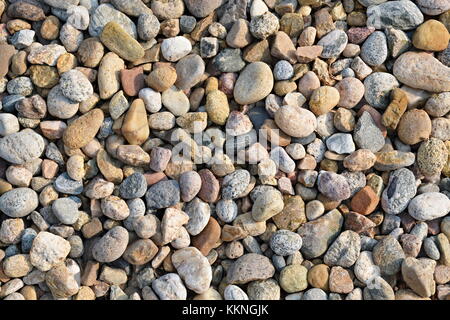 background of small multi-colored river rock stone texture Stock Photo