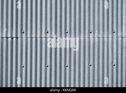 Old galvanized sheet texture background vertical with screws Stock Photo