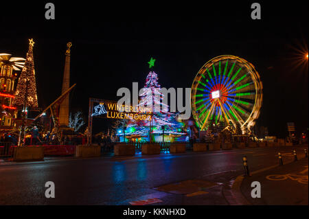 Ferris wheel in motion at night in Luxembourg christmas festival, Luxembourg City Stock Photo