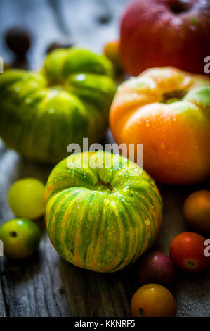 Heirloom Tomatoes On Rustic Background Stock Photo