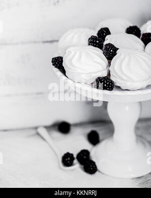 Meringue Cookies Witj Blackberries On Rustic Background Stock Photo