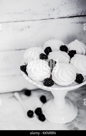 Meringue Cookies Witj Blackberries On Rustic Background Stock Photo