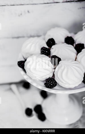 Meringue Cookies Witj Blackberries On Rustic Background Stock Photo