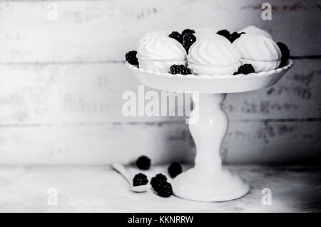 Meringue Cookies Witj Blackberries On Rustic Background Stock Photo